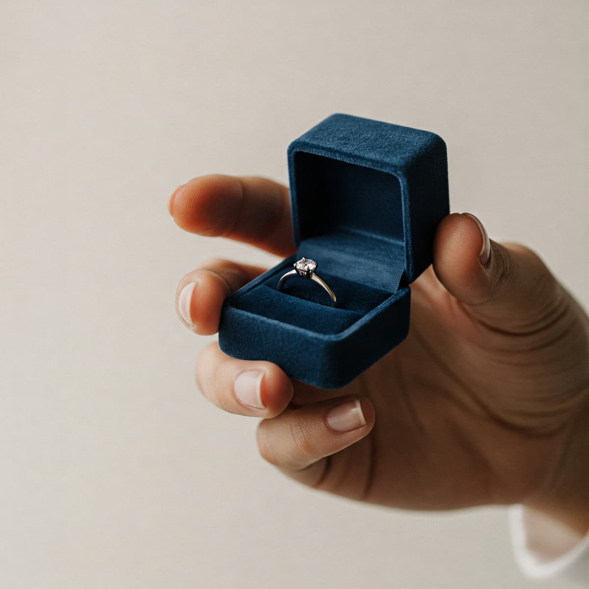 Craftsman working on custom jewelry - precision diamond setting